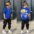 Blue cotton boys jogger set featuring a short-sleeved graphic t-shirt and matching elastic cuff pants