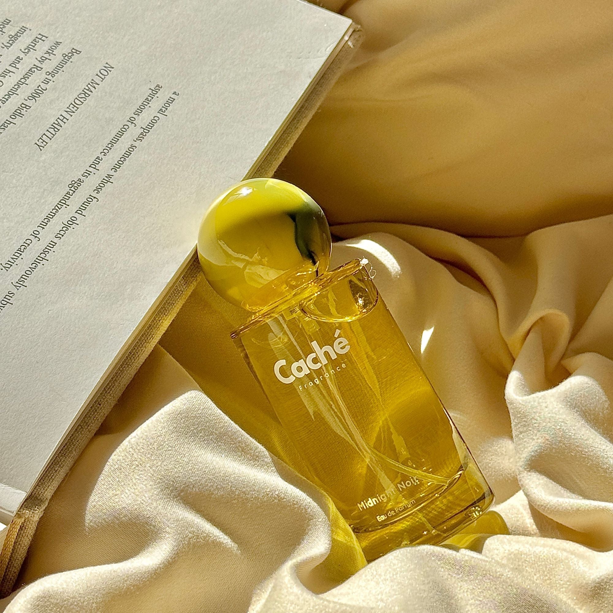 Caché Midnight Noir women's eau de parfum 50ml glass spray bottle with dark elegant packaging — view 3