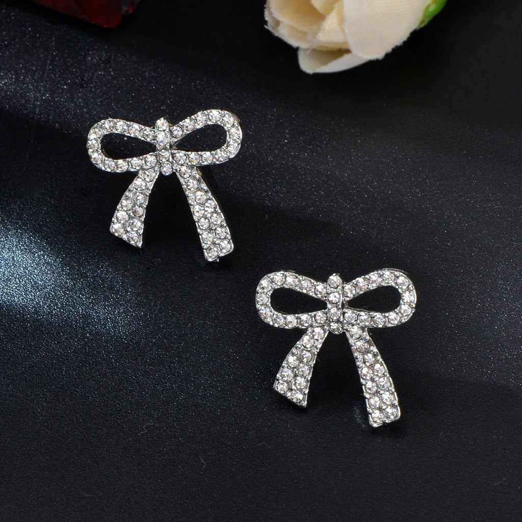 Sparkly rhinestone bow-knot stud earrings with a gold plated finish for elegant party wear. — view 5