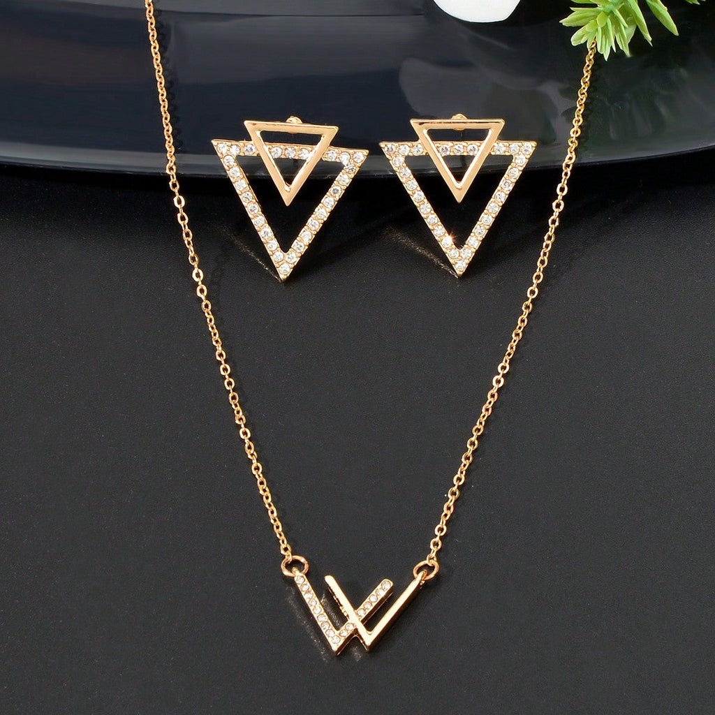 Double V pendant necklace and matching triangle earrings set featuring polished metallic geometric design.