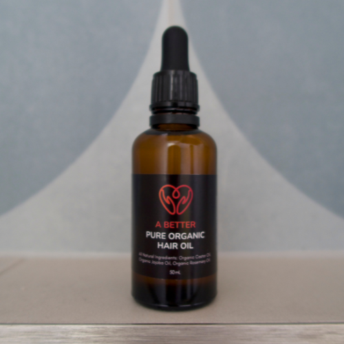 Pure organic hair oil in a 50mL amber glass bottle with a minimalist label