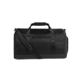Textured vegan leather duffle bag with sturdy carrying handles and adjustable shoulder strap for travel