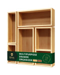 Set of five natural light wood storage boxes and drawer dividers arranged on a flat surface