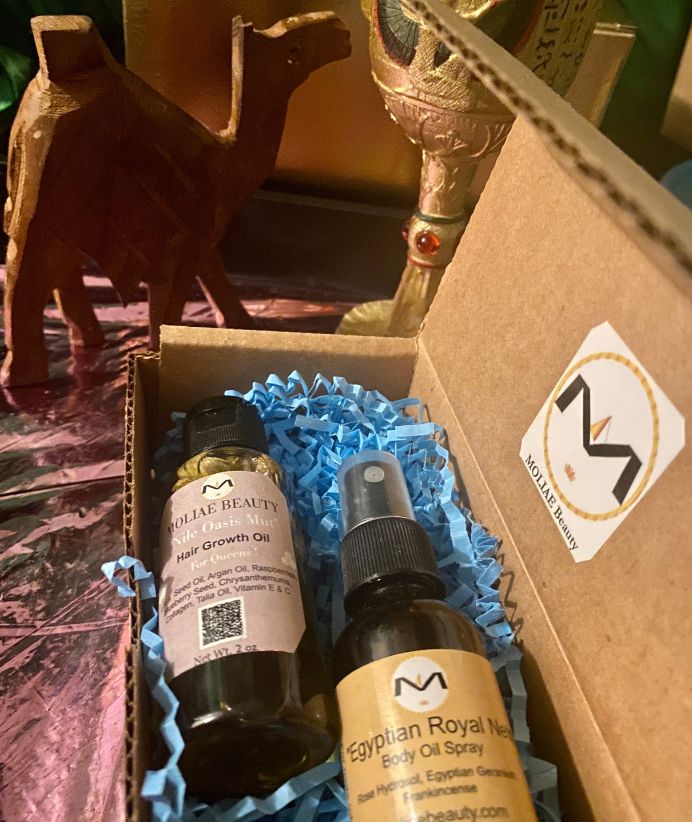 MOLIAE Beauty starter kit box featuring hair growth oil bottle and cucumber hydrating body spray