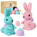 Rabbit amigurumi crochet kit showing finished plush bunny, premium threads, hook, and instructions