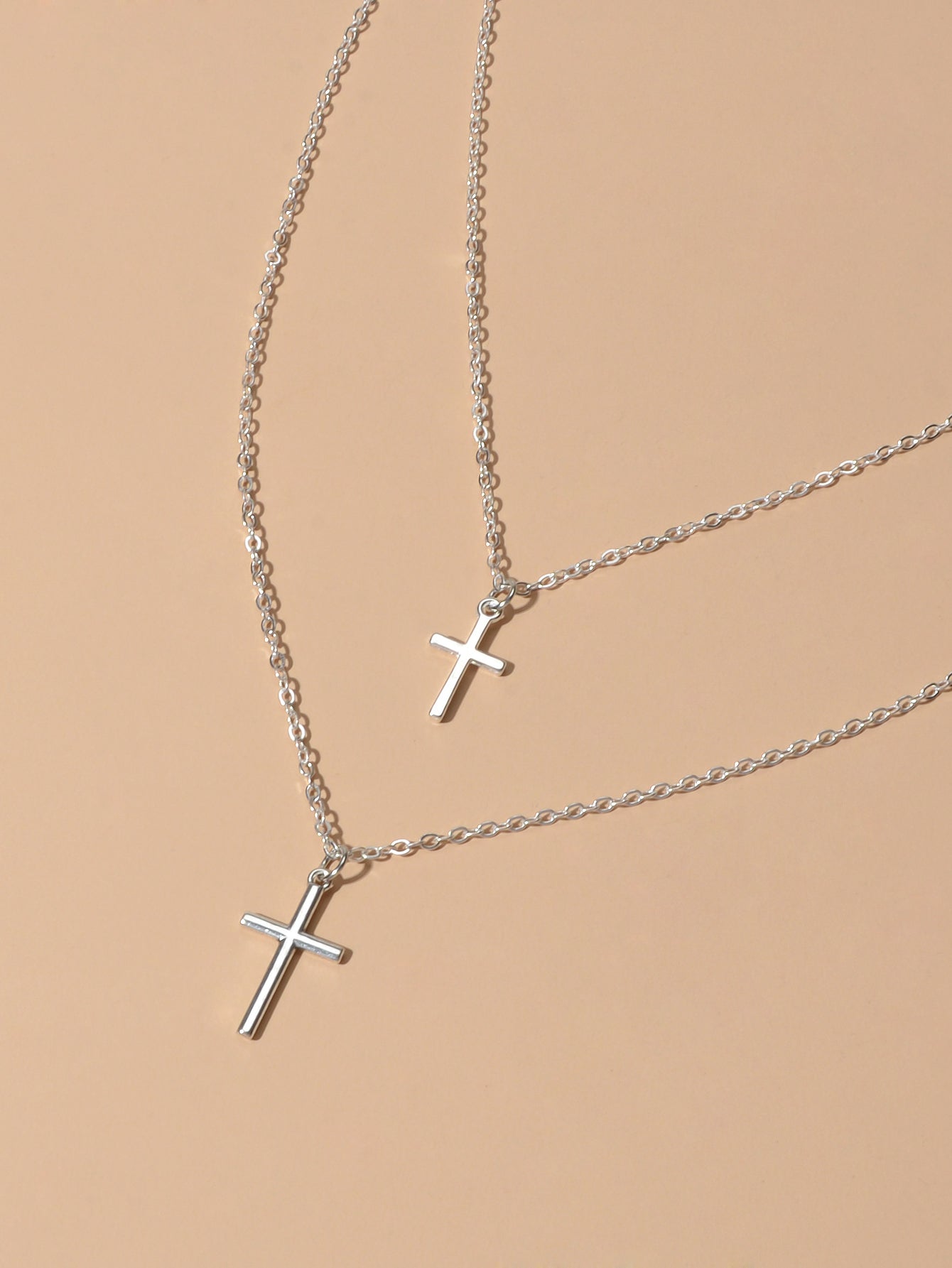 Silver double layer cross necklace featuring delicate chains and a minimalist pendant for women — view 4
