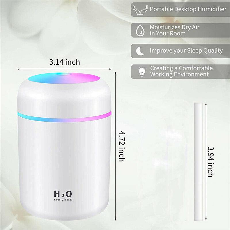 Portable USB car humidifier and essential oil diffuser emitting cool mist on a desk — view 3