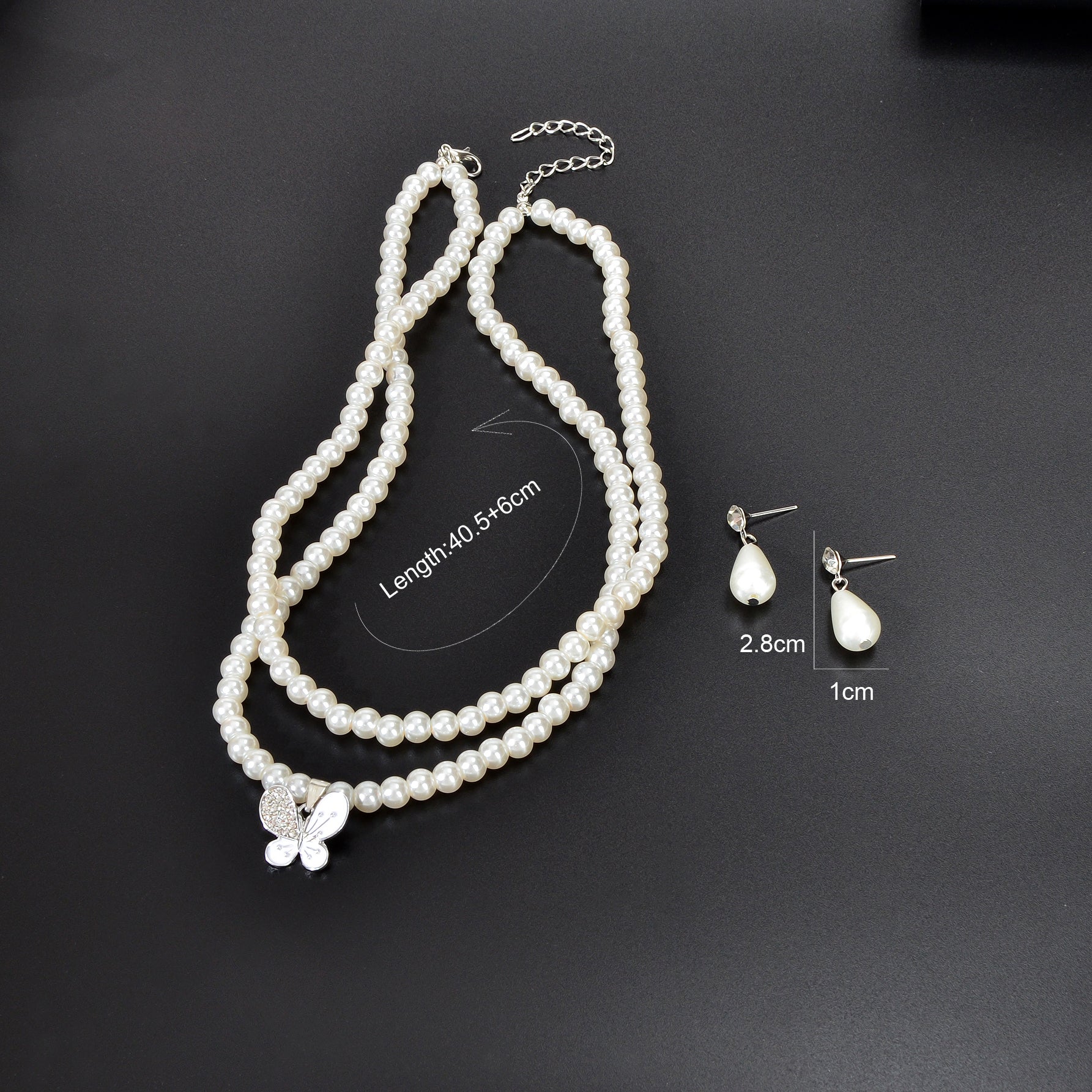 Imitation pearl jewelry set featuring a double layered necklace and matching water drop earrings — view 4
