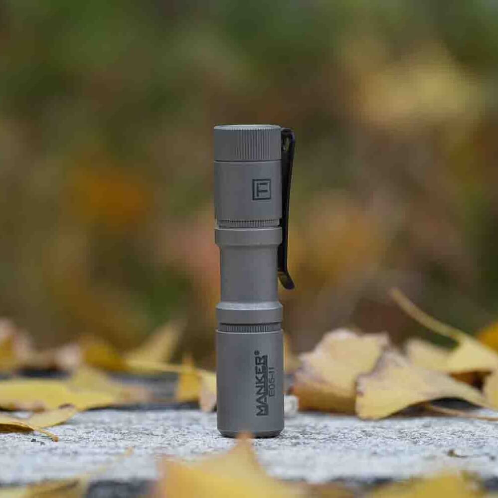 Manker E05II Ti EDC Flashlight in bead-blasted titanium with deep carry pocket clip — view 2