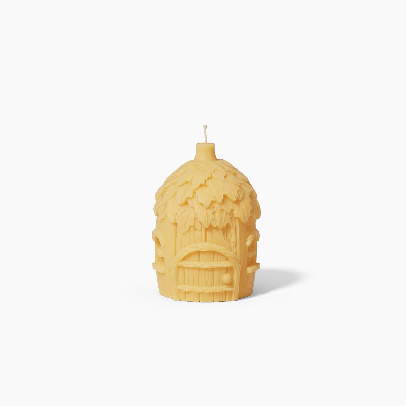 Miniature fairy house candle silicone mold featuring detailed shingled roof and round windows