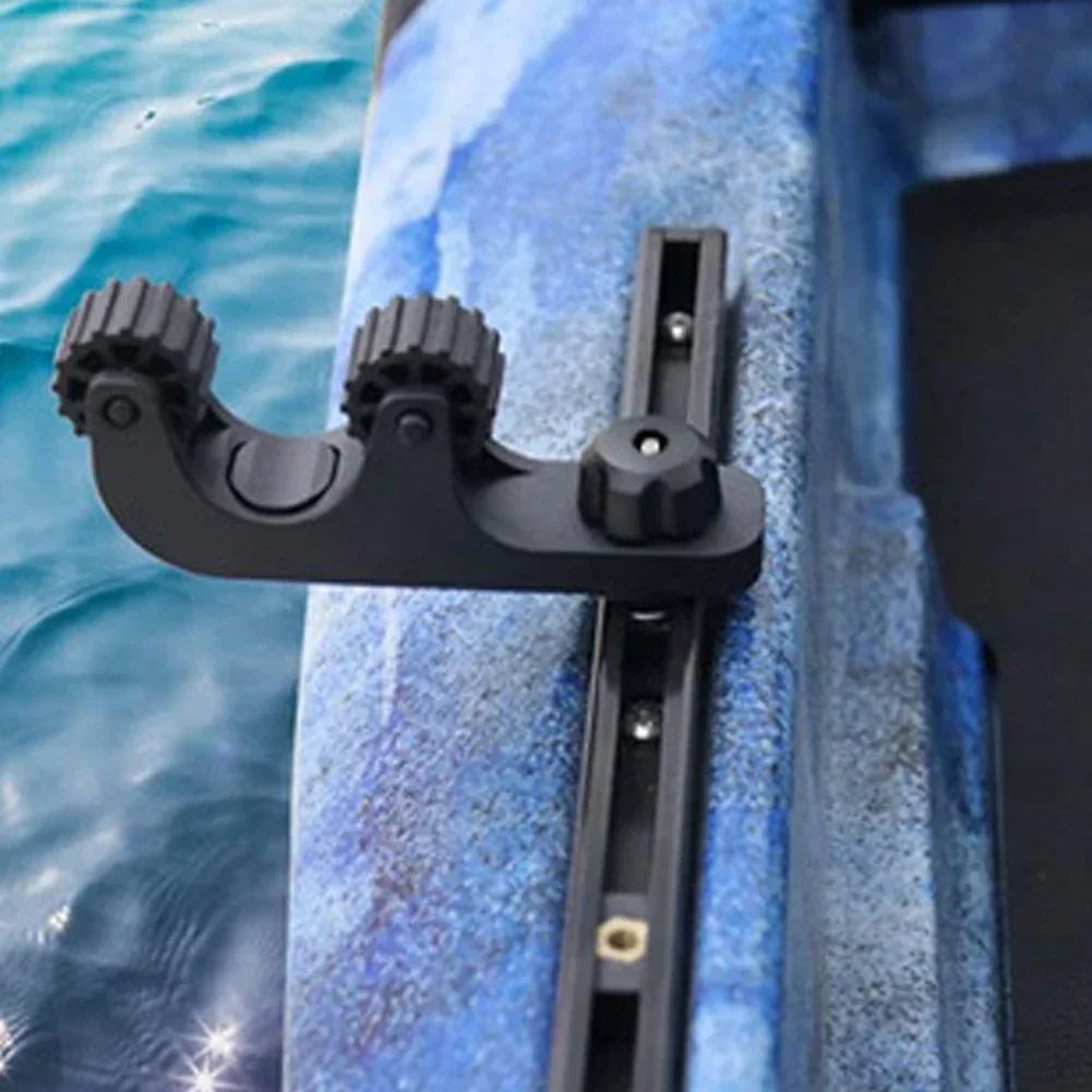 Black ABS kayak paddle holder rack with rubber rollers and threaded track mount bolts. — view 2