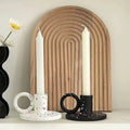 Two trendy splash-ink resin candle holders featuring a modern Nordic design on a flat surface