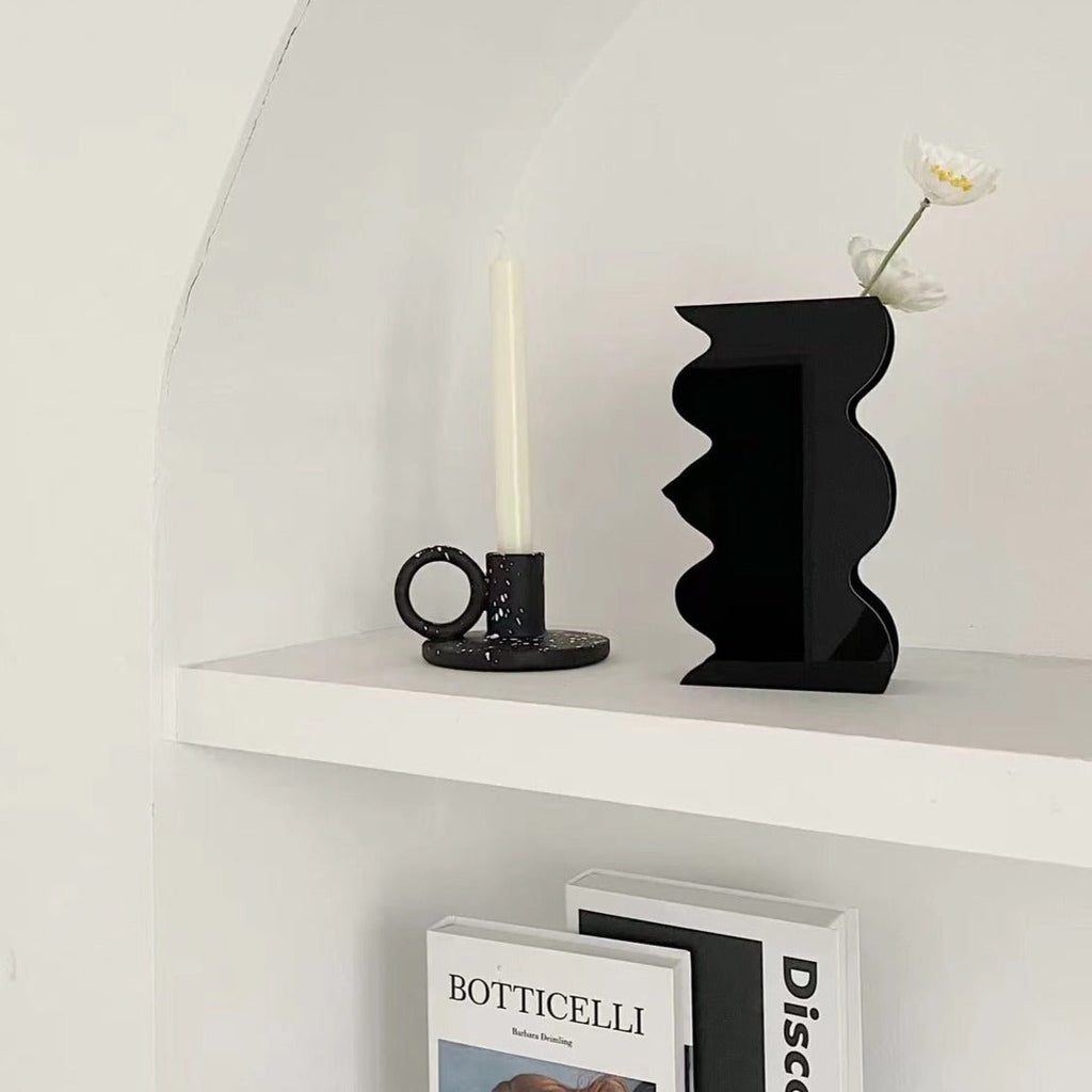 Two trendy splash-ink resin candle holders featuring a modern Nordic design on a flat surface — view 4