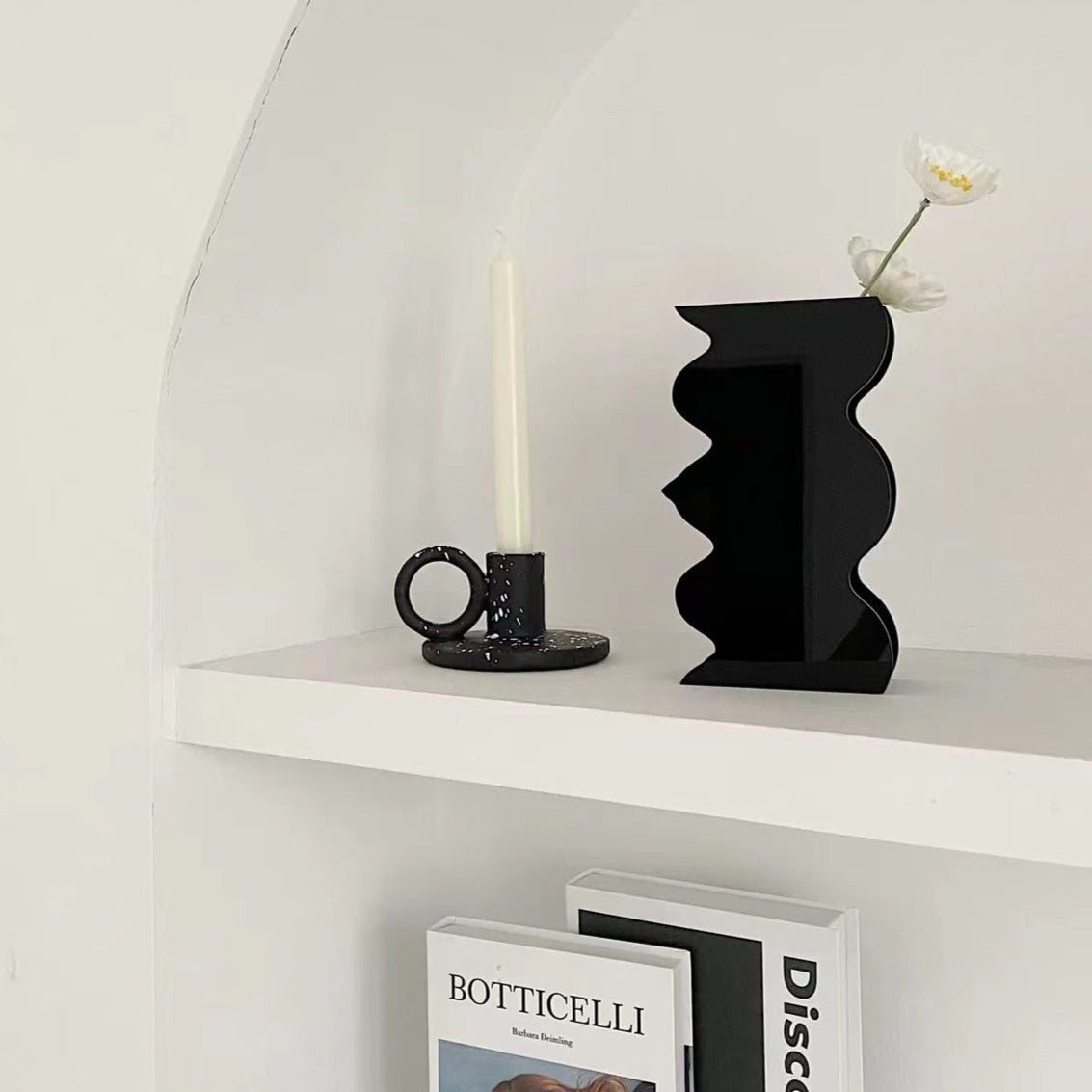 Two trendy splash-ink resin candle holders featuring a modern Nordic design on a flat surface — view 4