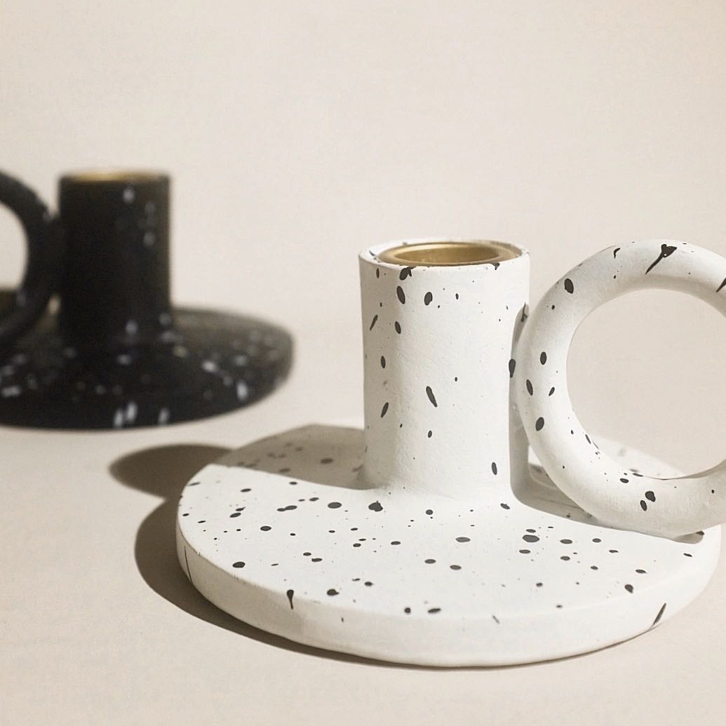 Two trendy splash-ink resin candle holders featuring a modern Nordic design on a flat surface — view 2