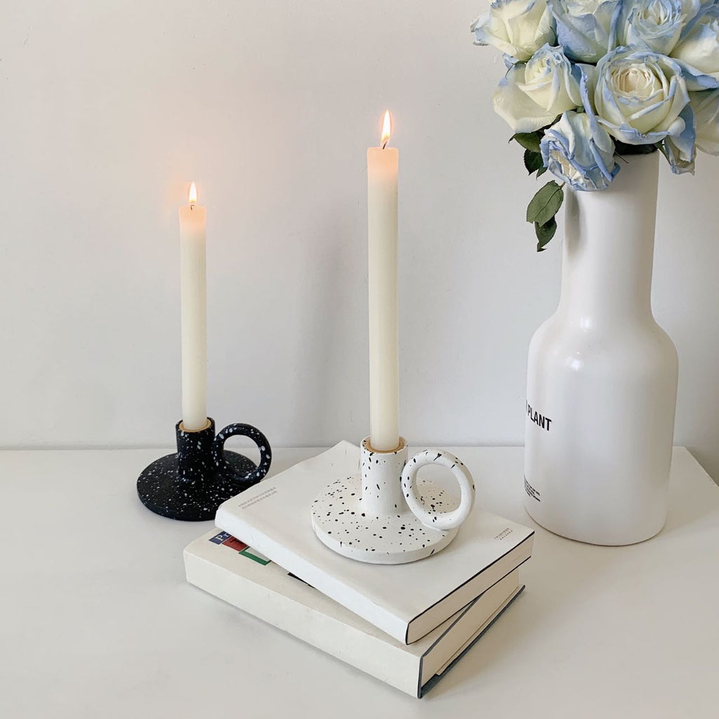 Two trendy splash-ink resin candle holders featuring a modern Nordic design on a flat surface — view 3