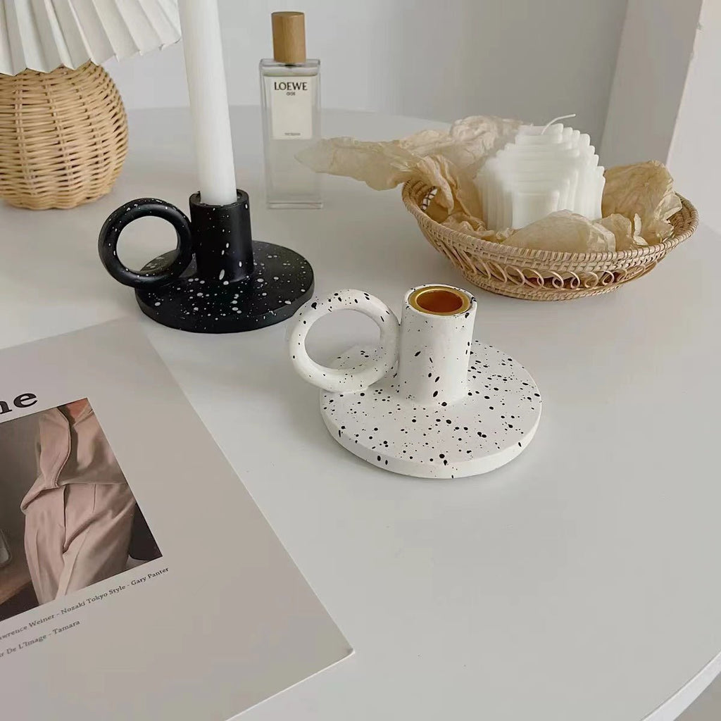 Two trendy splash-ink resin candle holders featuring a modern Nordic design on a flat surface — view 5