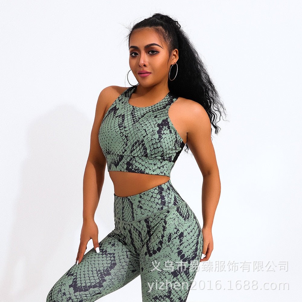Two-piece snake print yoga set with green sleeveless sports bra and matching high-waisted fitness leggings — view 2
