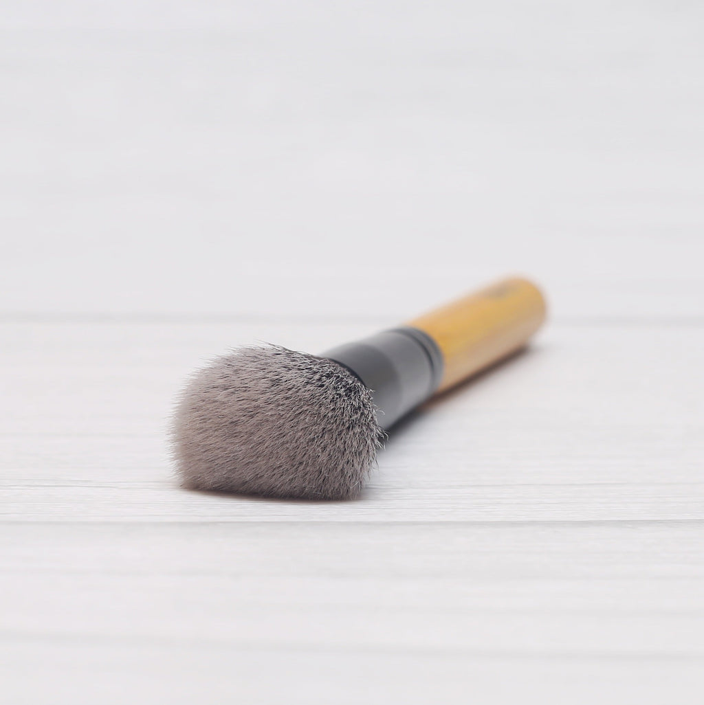 Vegan highlighter brush with natural bamboo handle and soft synthetic bristles for precision makeup — view 5