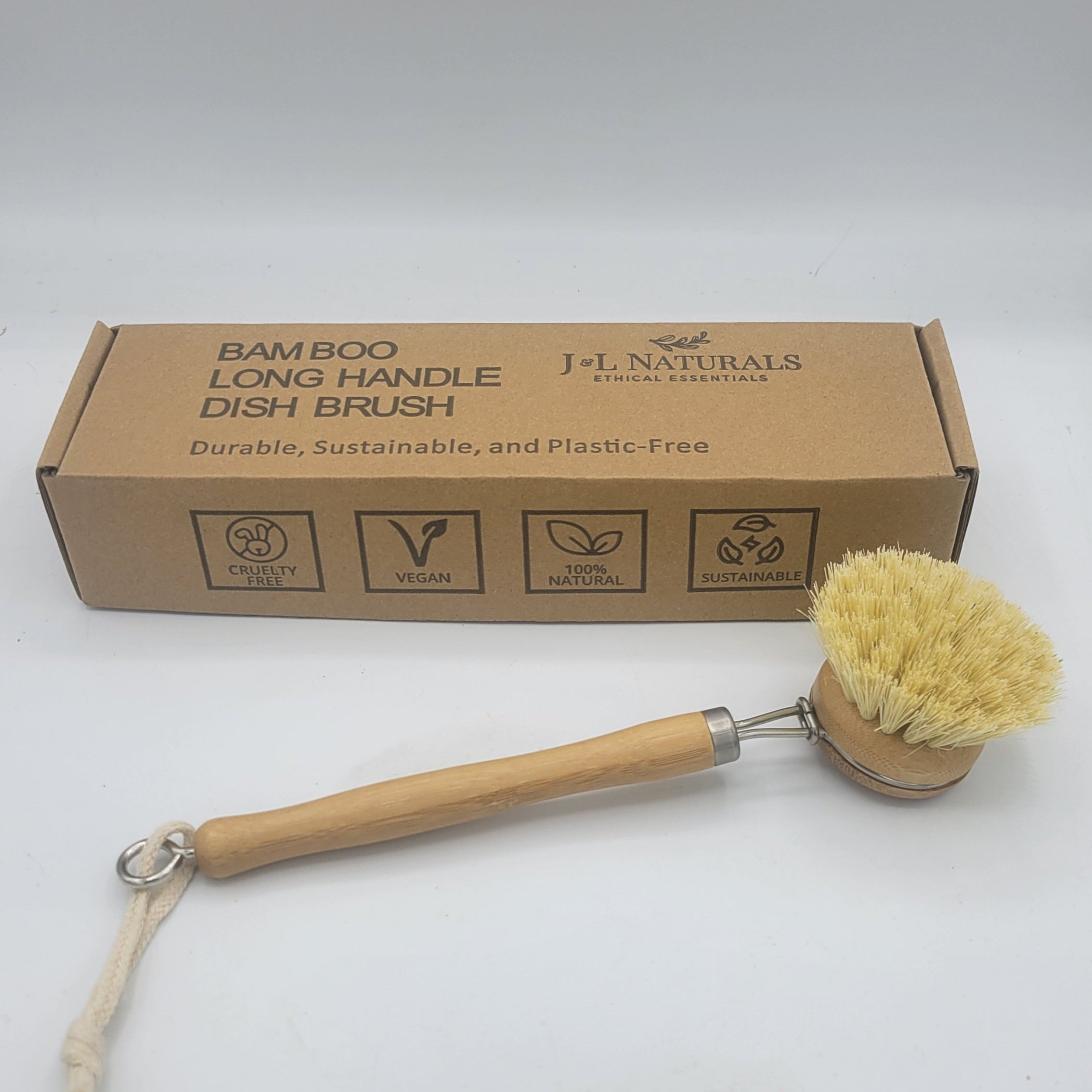 Bamboo long handle dish brush with natural sisal bristles on a kitchen counter — view 4