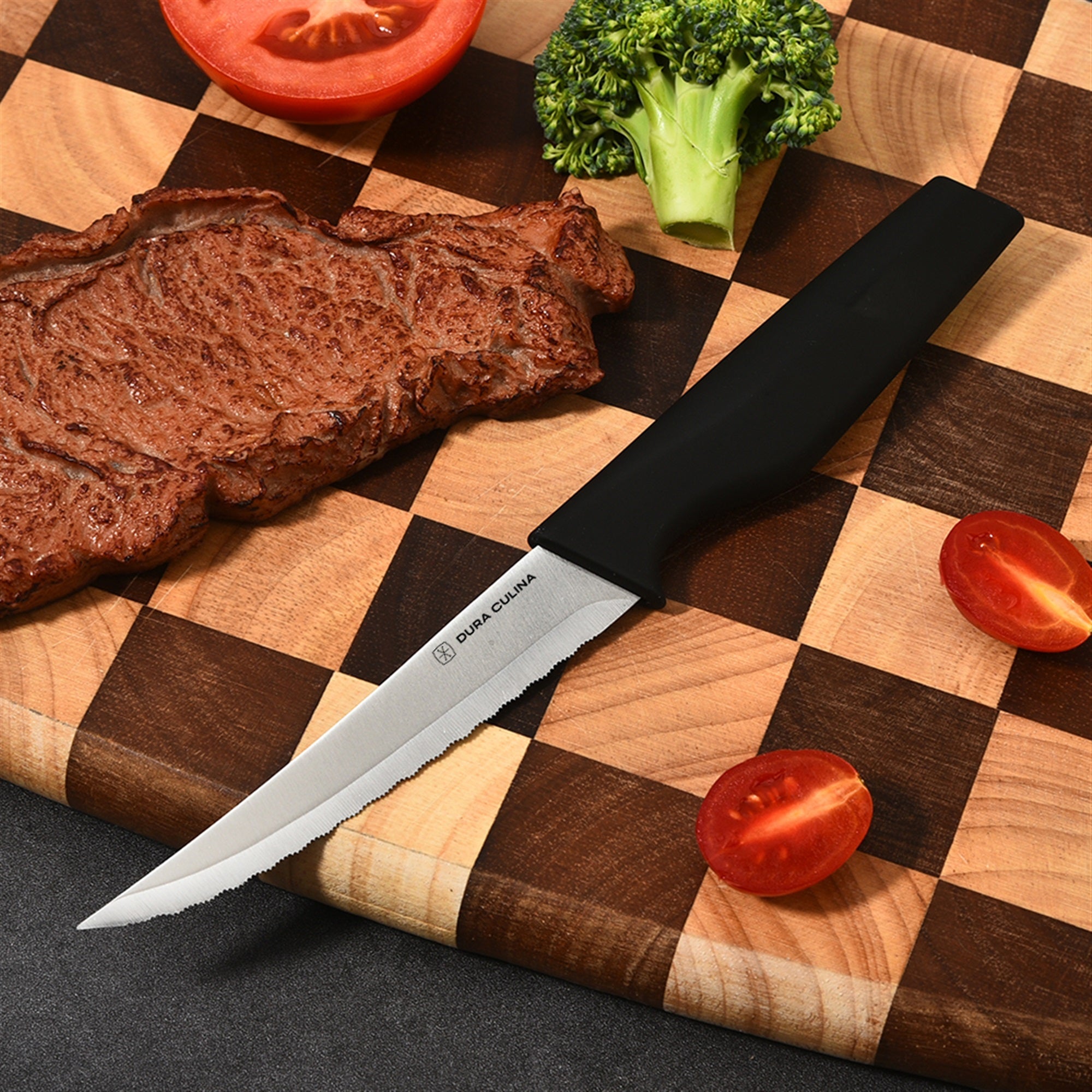 4-piece steak knife set featuring serrated high carbon stainless steel blades and ergonomic soft-grip handles. — view 3