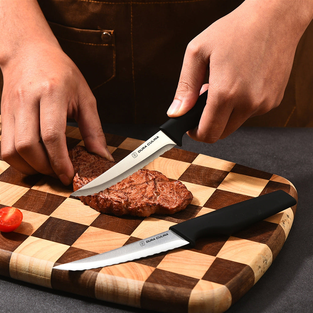 4-piece steak knife set featuring serrated high carbon stainless steel blades and ergonomic soft-grip handles. — view 4