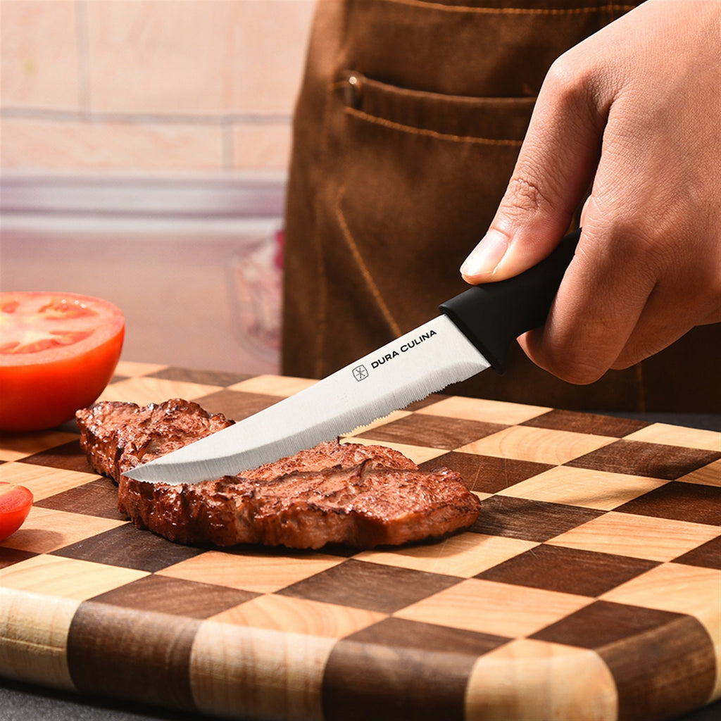 4-piece steak knife set featuring serrated high carbon stainless steel blades and ergonomic soft-grip handles. — view 5