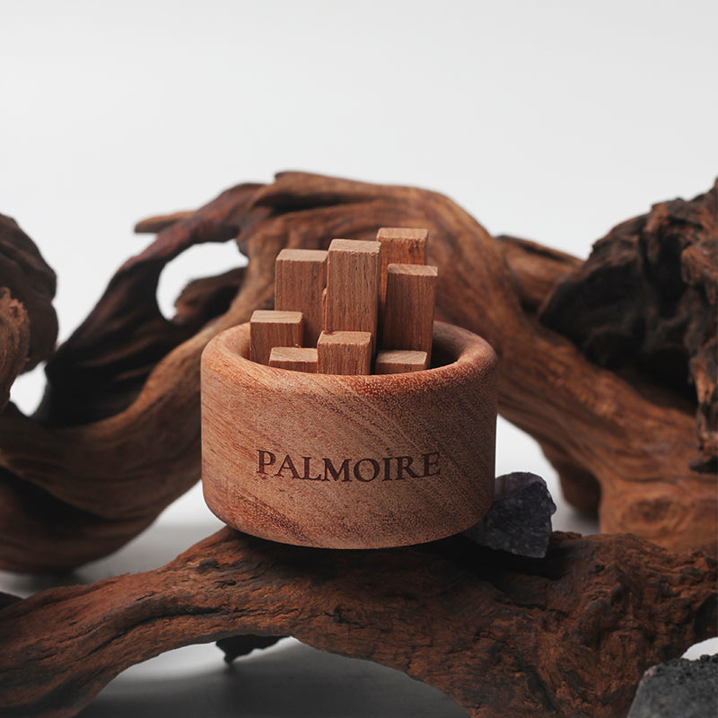 Rosewood essential oil diffuser with rich wood grain pattern for natural home fragrance and aromatherapy.
