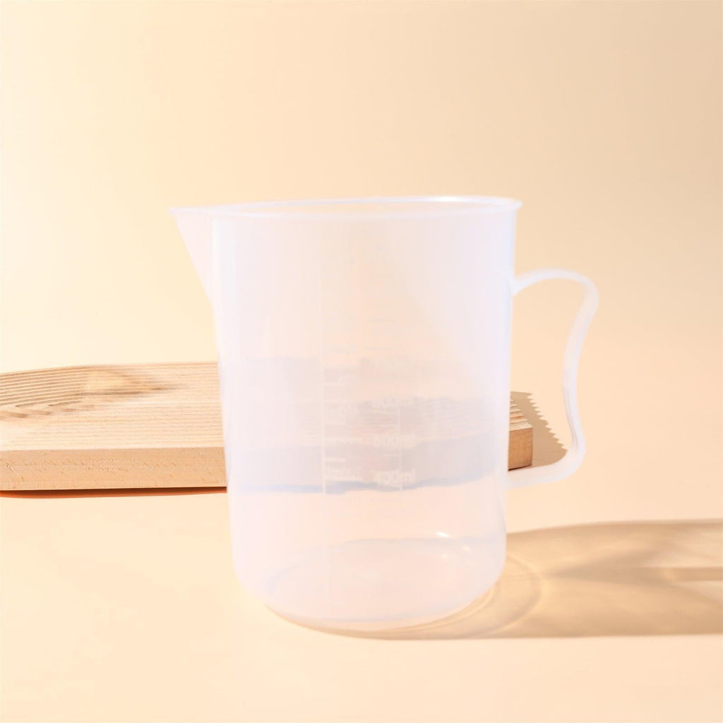 Clear 1000ml measuring cup with precise graduation marks and convenient pour spout for kitchen use — view 2