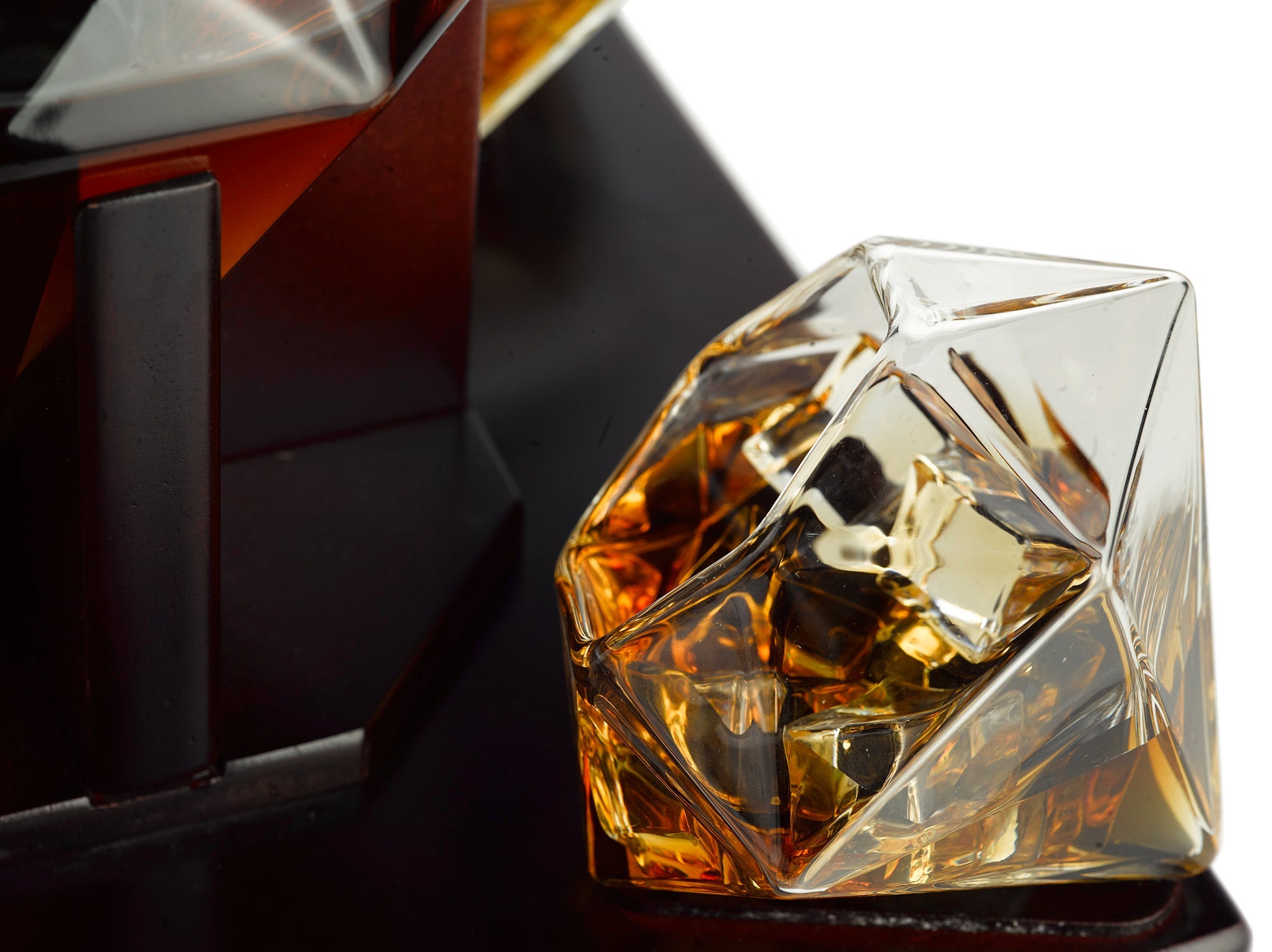 Diamond whiskey decanter set with four tasting glasses resting on an elegant mahogany wooden base — view 3