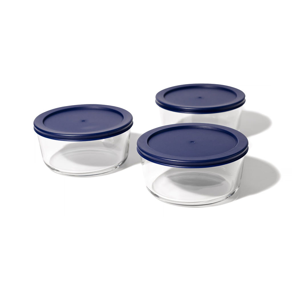 Six piece round glass storage container set with blue airtight lids for meal preparation