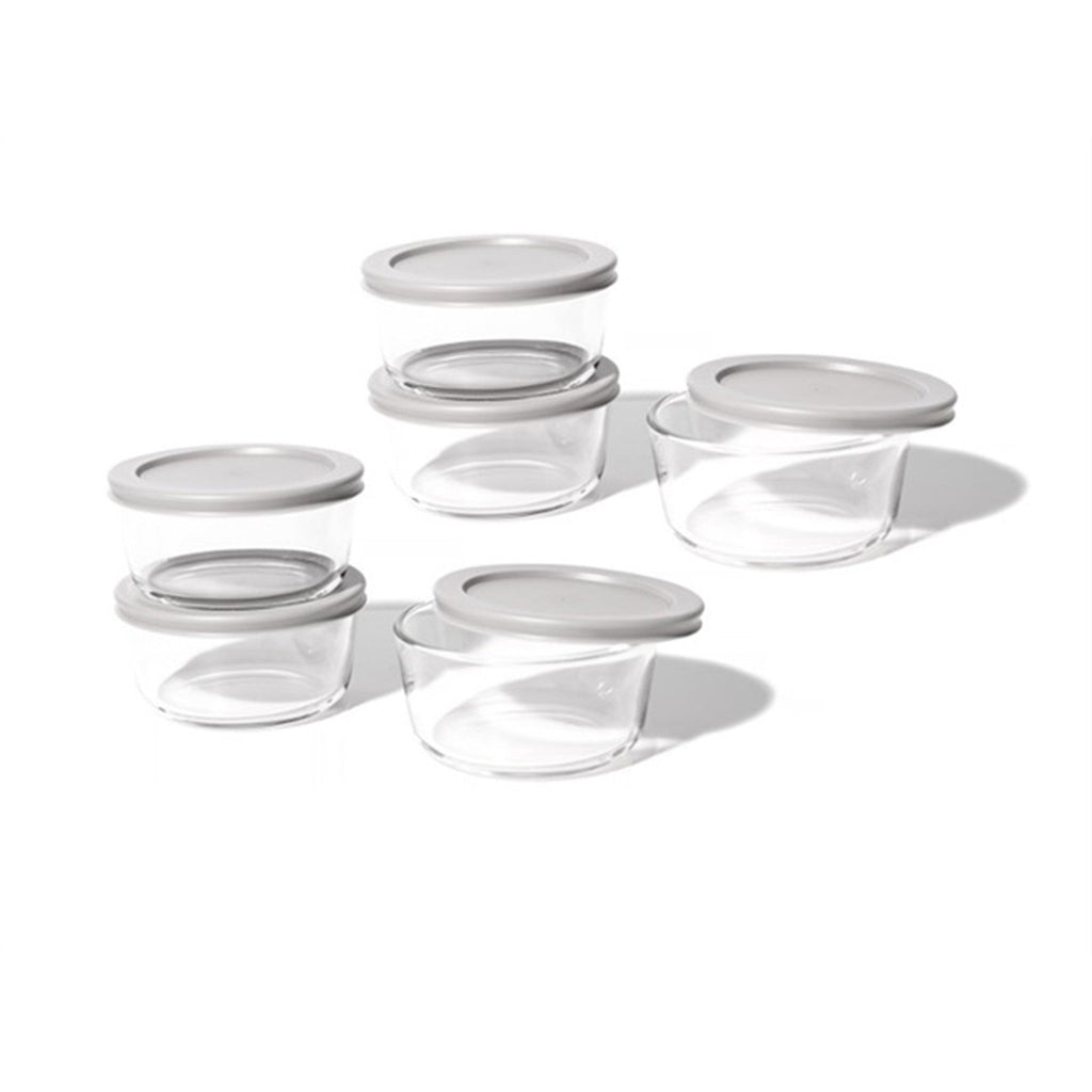 12 piece round glass food storage containers with grey airtight lids on kitchen counter