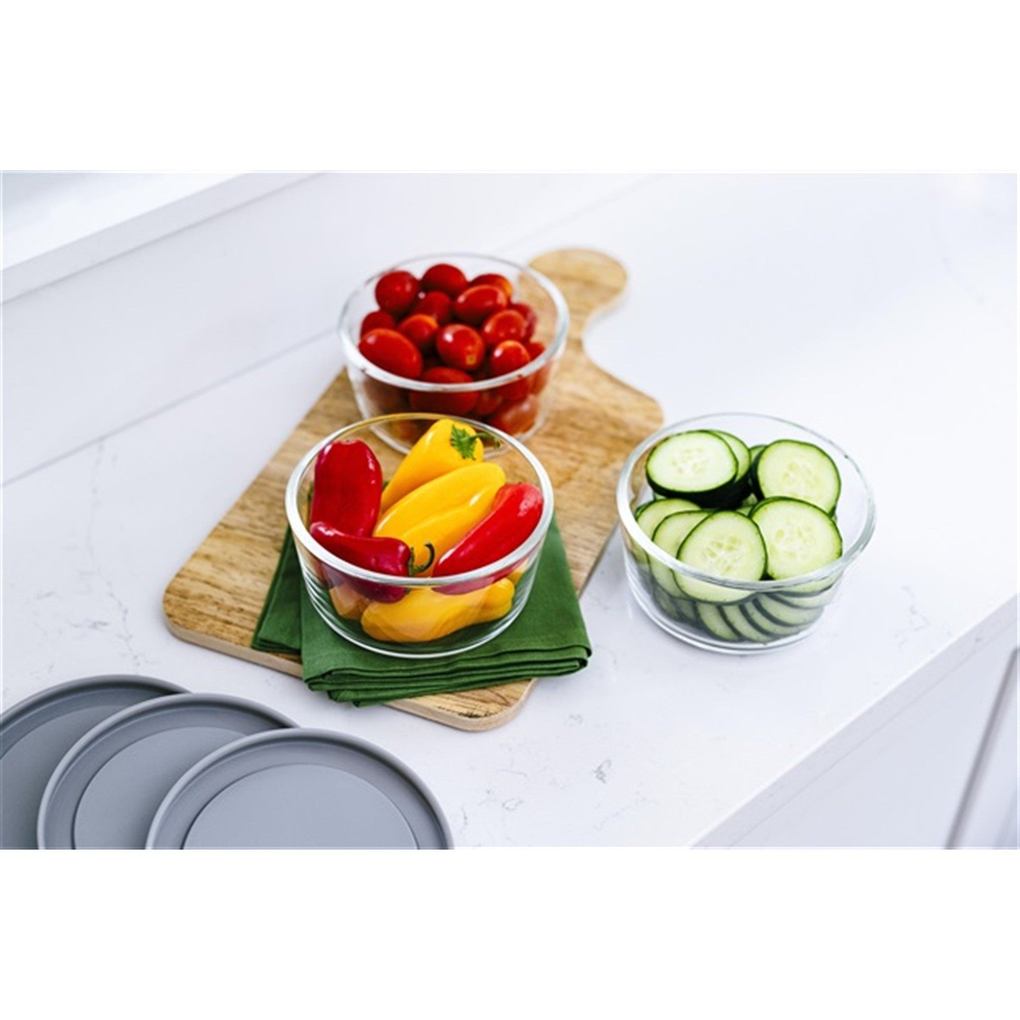12 piece round glass food storage containers with grey airtight lids on kitchen counter — view 4