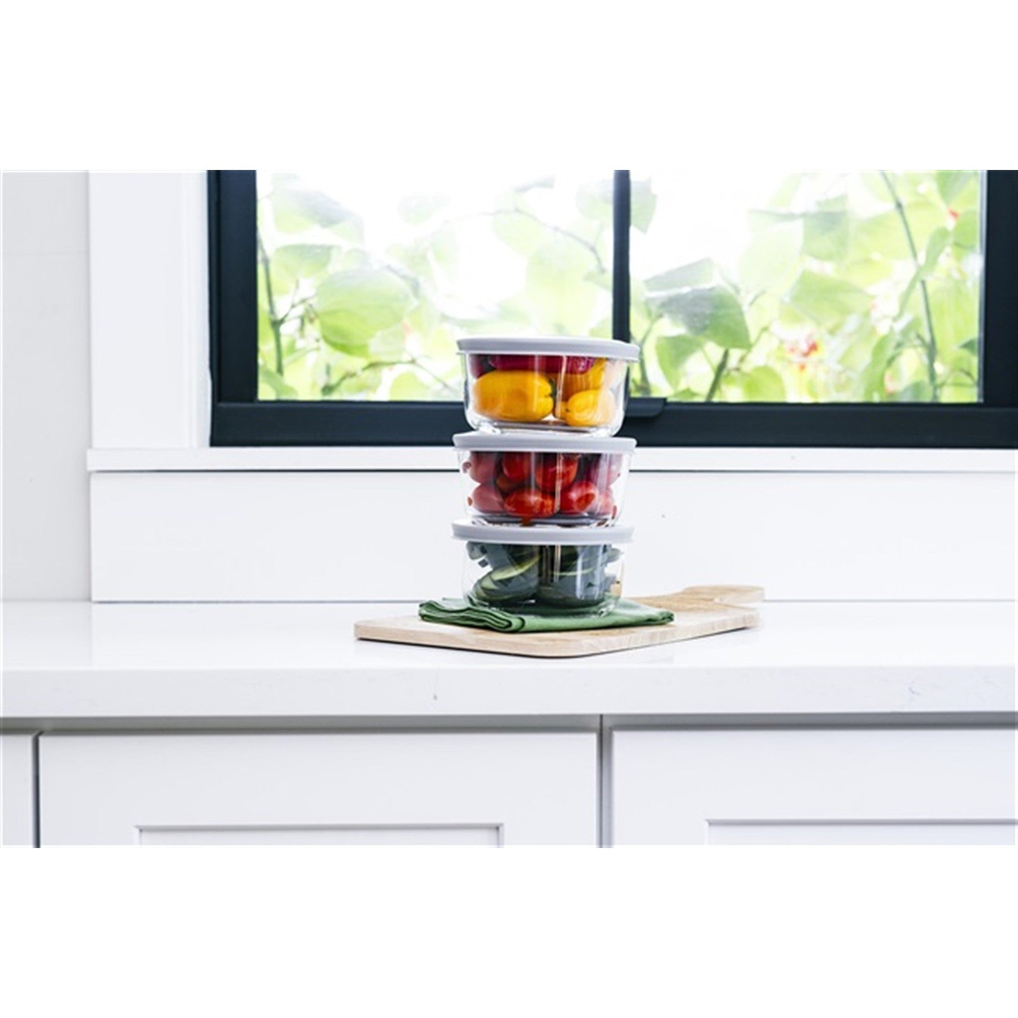 12 piece round glass food storage containers with grey airtight lids on kitchen counter — view 5