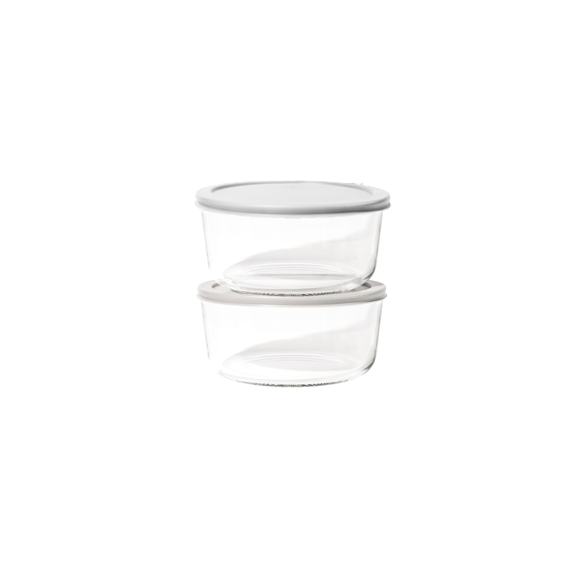 Four piece round glass food storage containers with airtight grey lids for kitchen organization