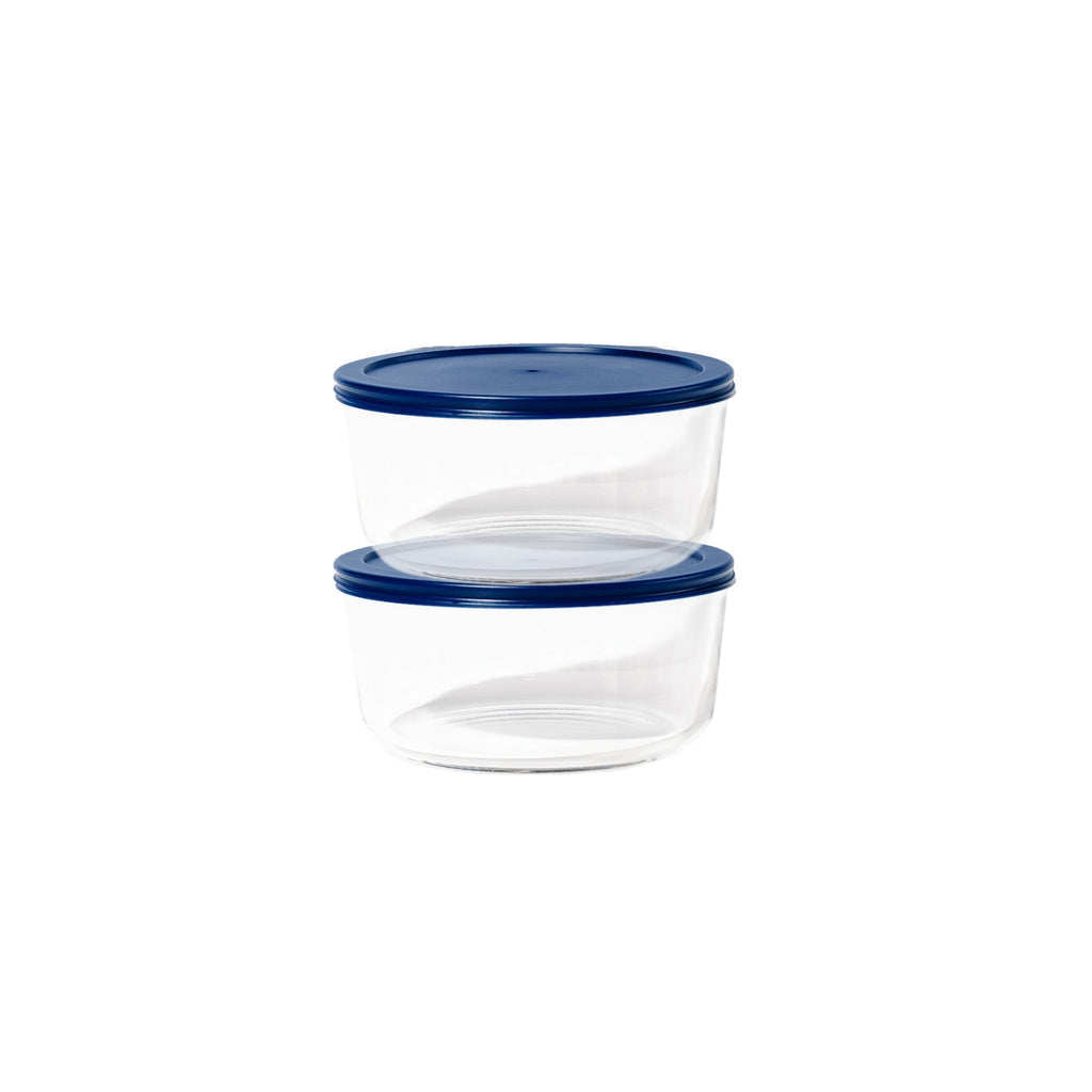 Four piece round glass food storage container set with airtight blue lids for kitchen meal prep