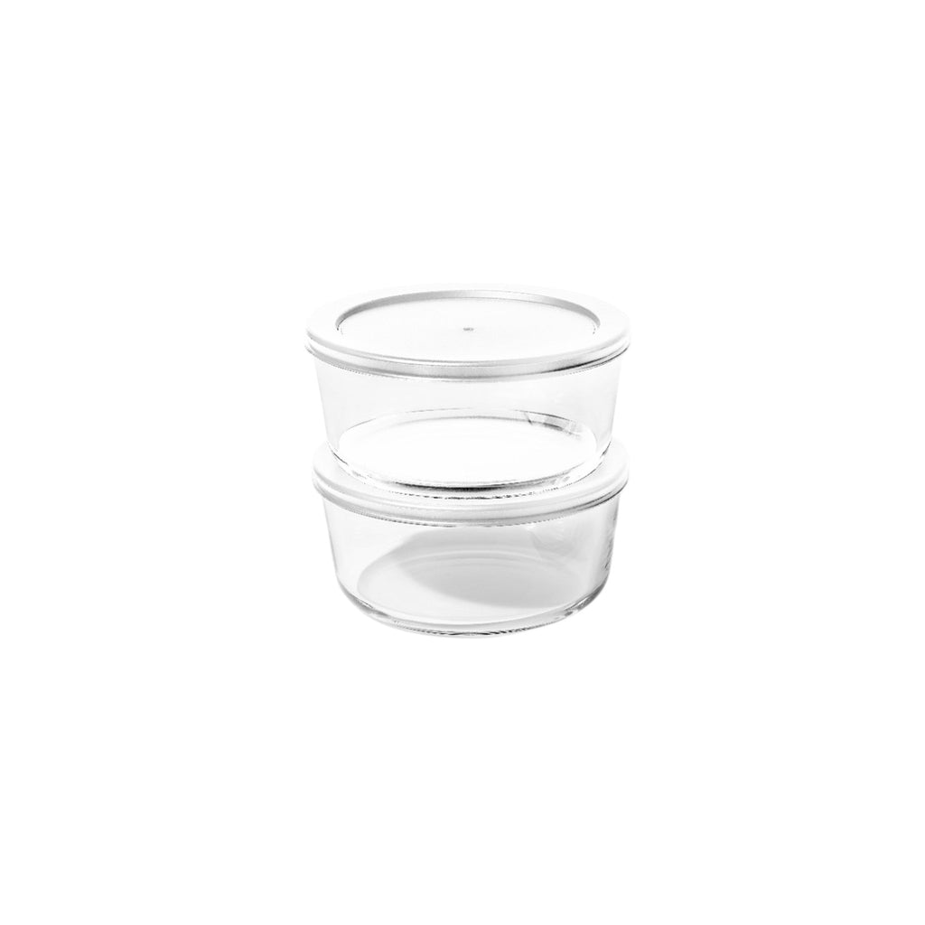 Four piece round borosilicate glass storage containers with airtight white lids for kitchen meal prep
