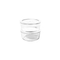 Four piece round borosilicate glass storage containers with airtight white lids for kitchen meal prep