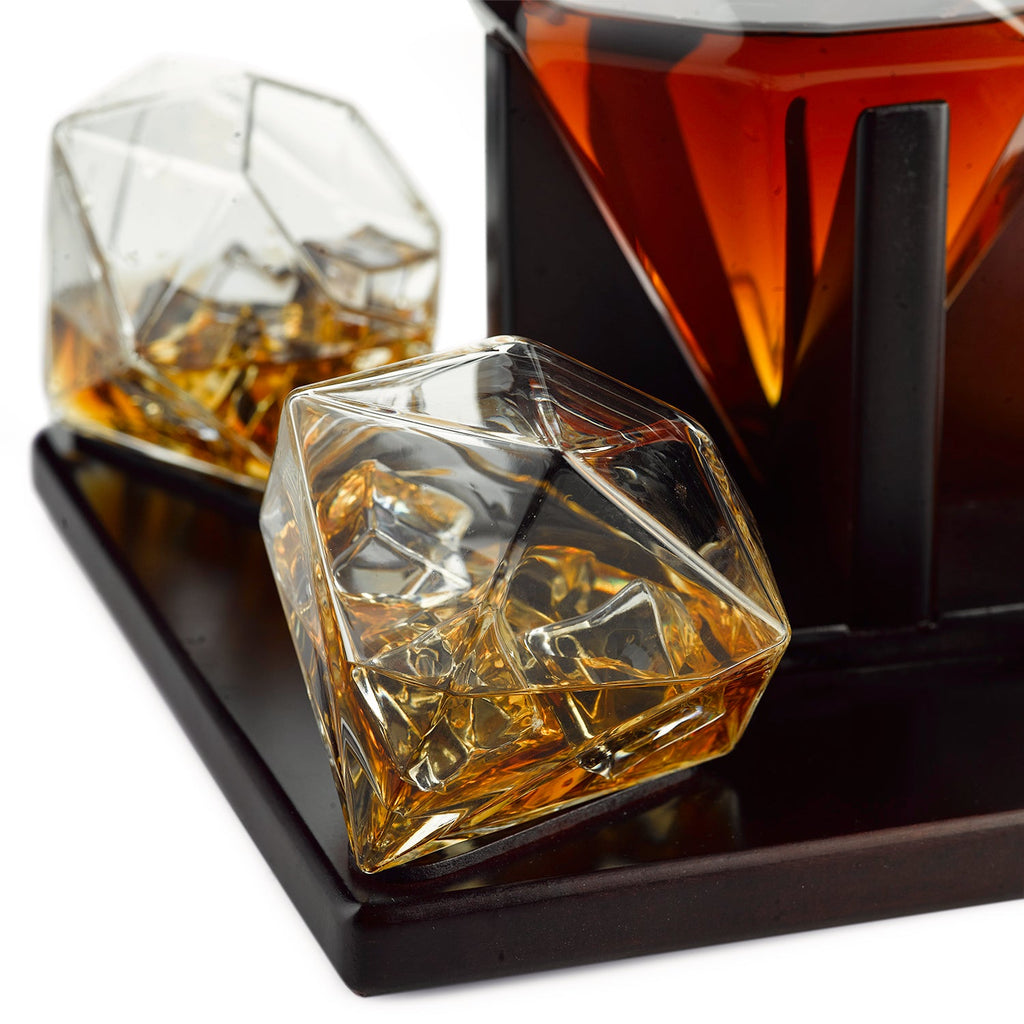 Diamond whiskey decanter set with four tasting glasses resting on an elegant mahogany wooden base — view 5