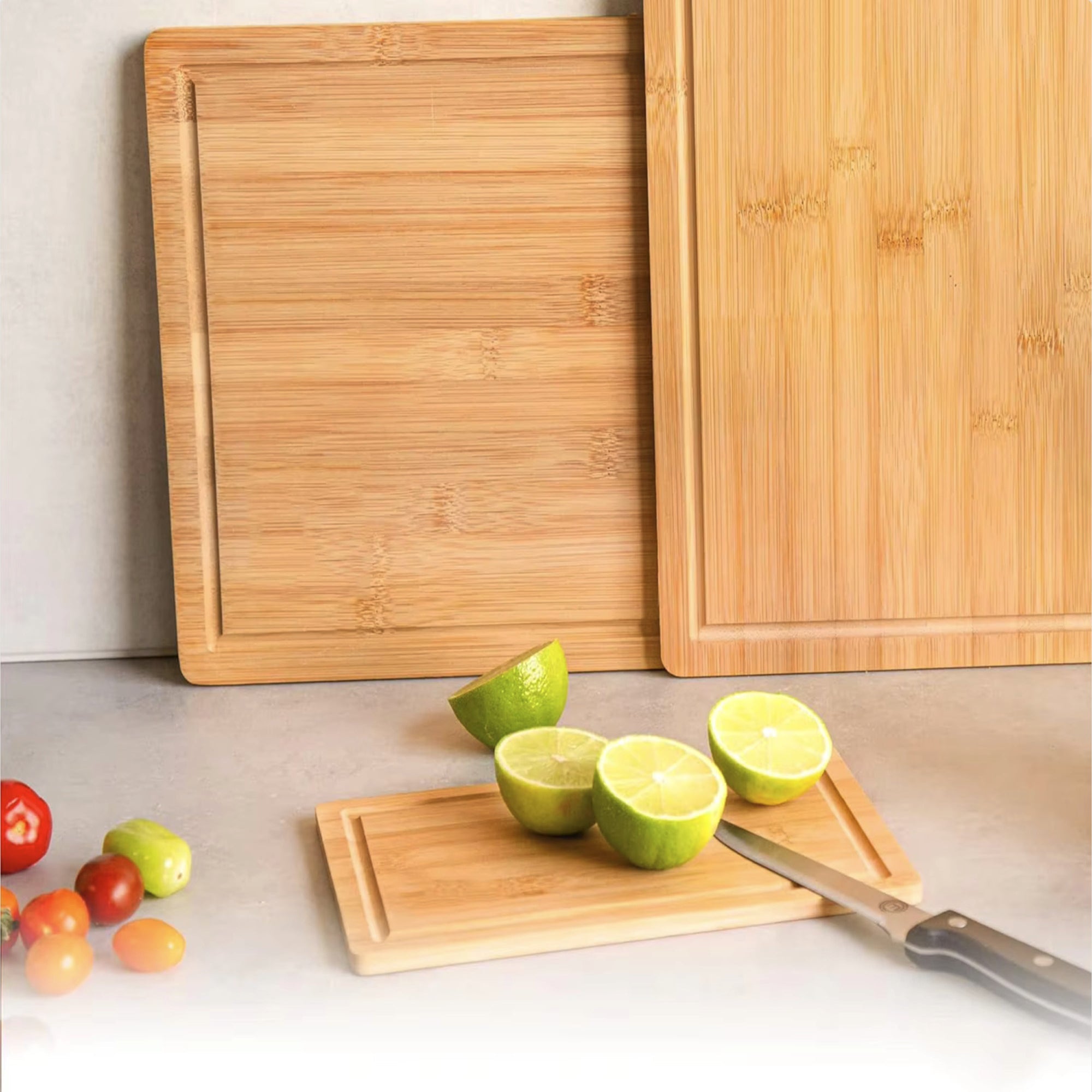 Three piece natural bamboo and acacia wood cutting board set in large medium and compact sizes — view 3
