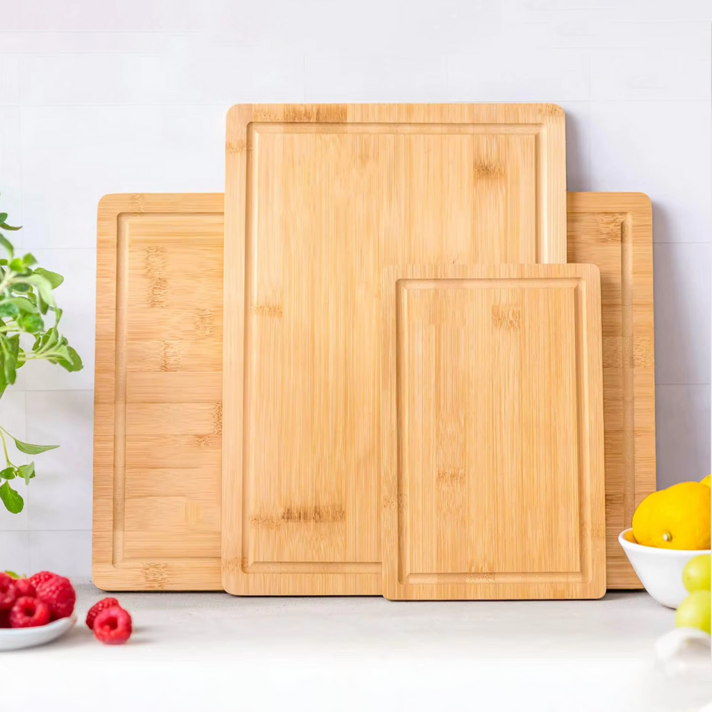 Three piece natural bamboo and acacia wood cutting board set in large medium and compact sizes