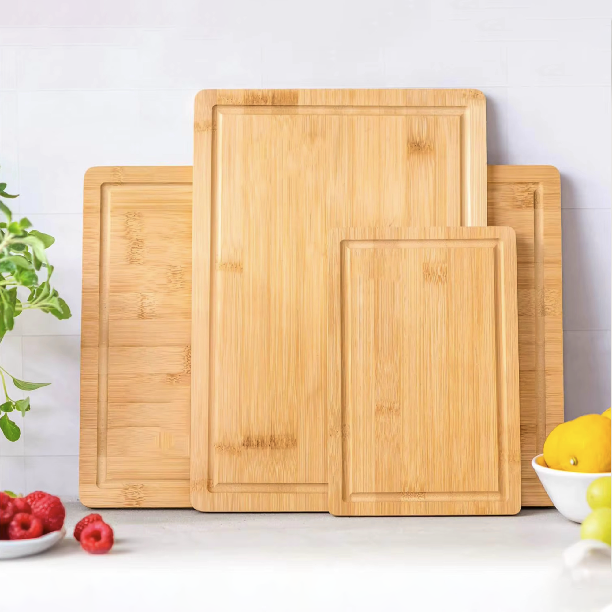 Three piece natural bamboo and acacia wood cutting board set in large medium and compact sizes