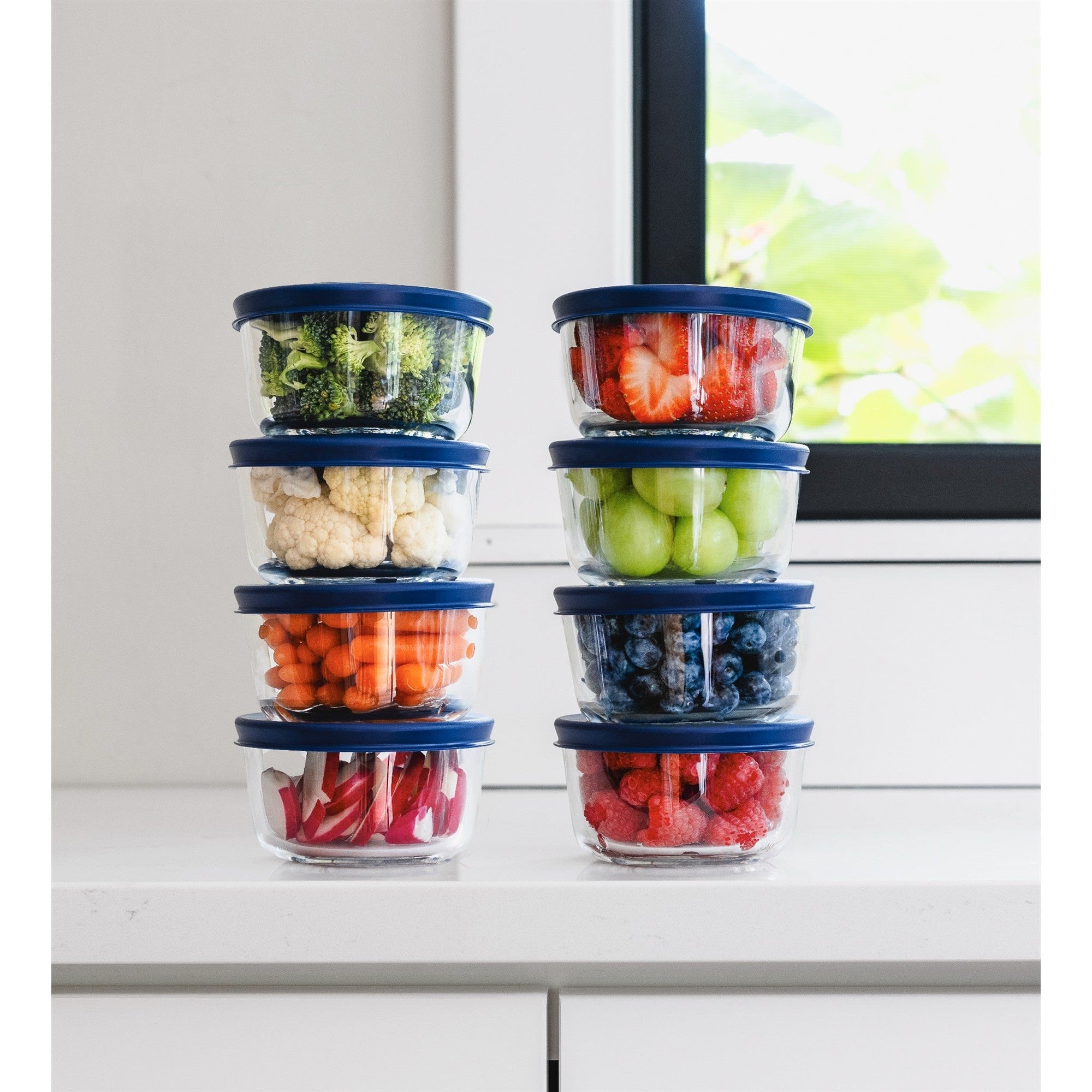 Round glass food storage containers with vibrant blue airtight lids for kitchen meal prep — view 2