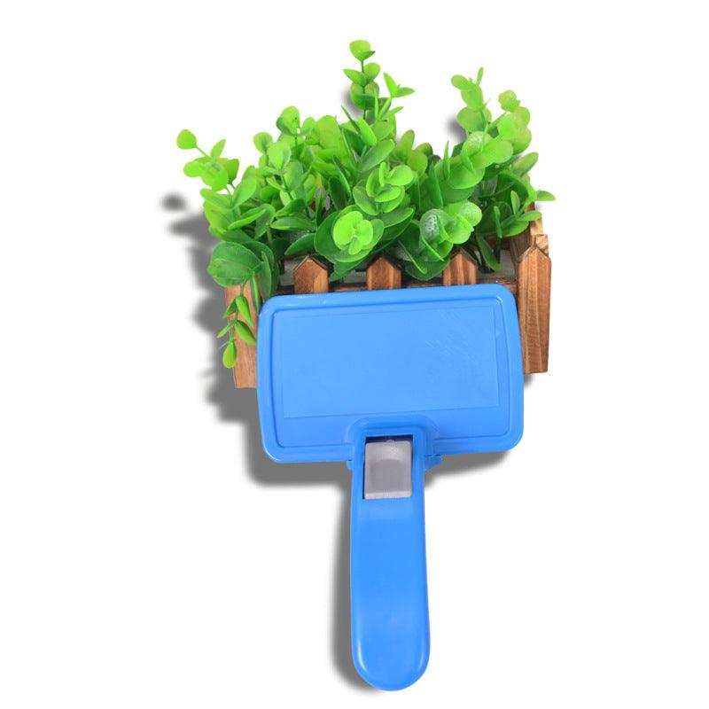 Self-cleaning pet hair grooming tool and brush with ergonomic handle for dogs and cats — view 3