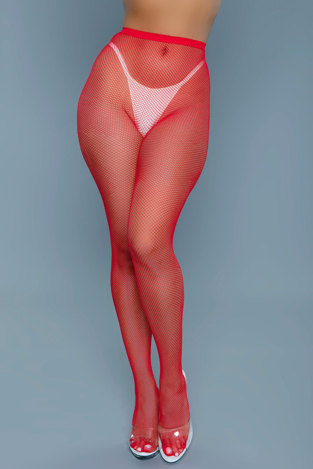 Black high waist fishnet pantyhose on a model showcasing toe to waist edgy hosiery style