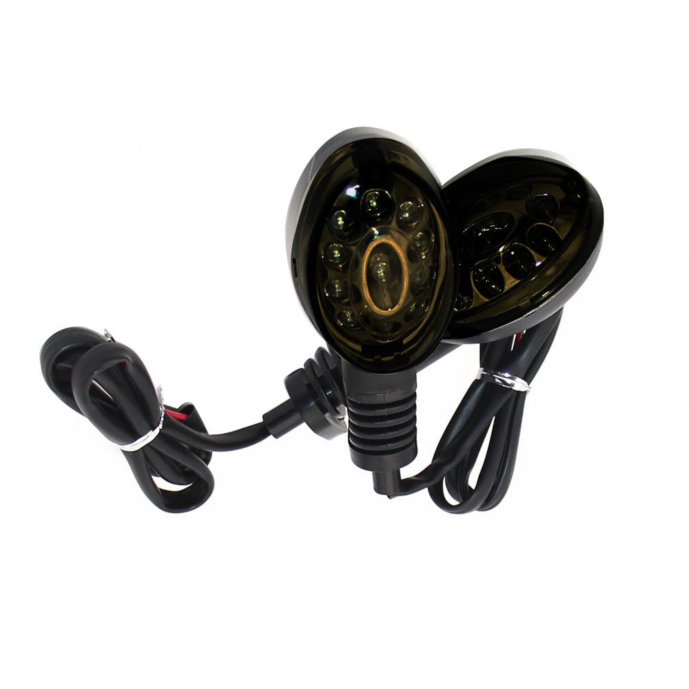 Smoke lens amber LED motorcycle turn signal indicator lights with connecting cables on white background — view 3