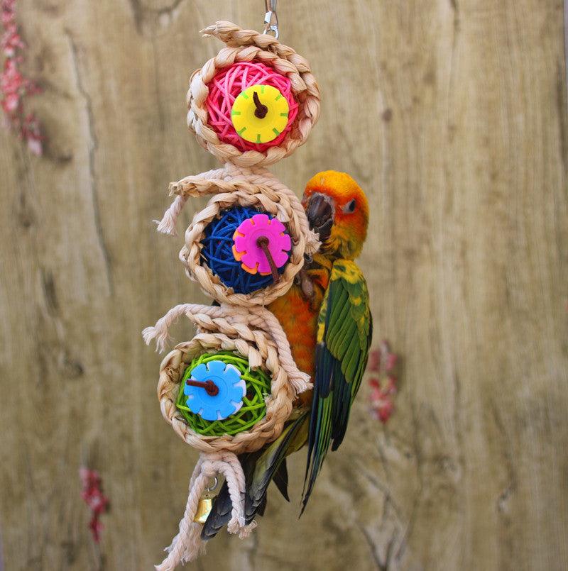 Natural vine twist rope parrot toy made of wood, luffa sponge, and rattan with metal hanger