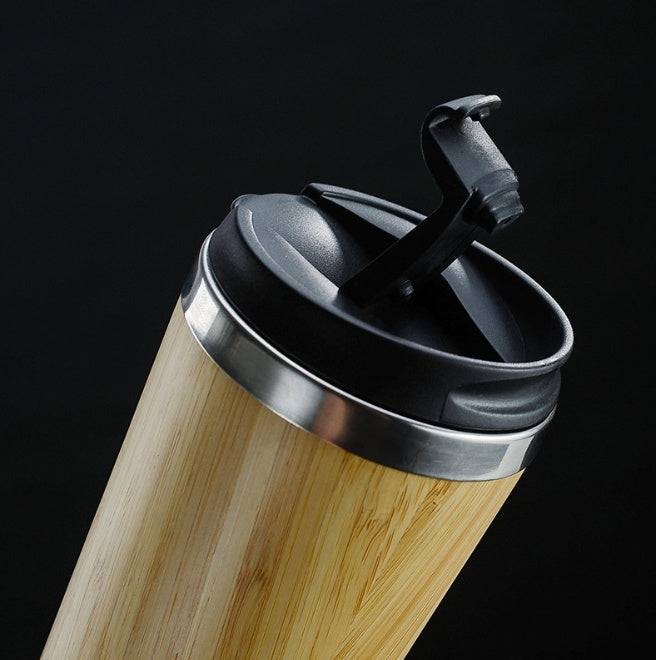 Leakproof bamboo travel mug with stainless steel interior and non-slip silicone base — view 4