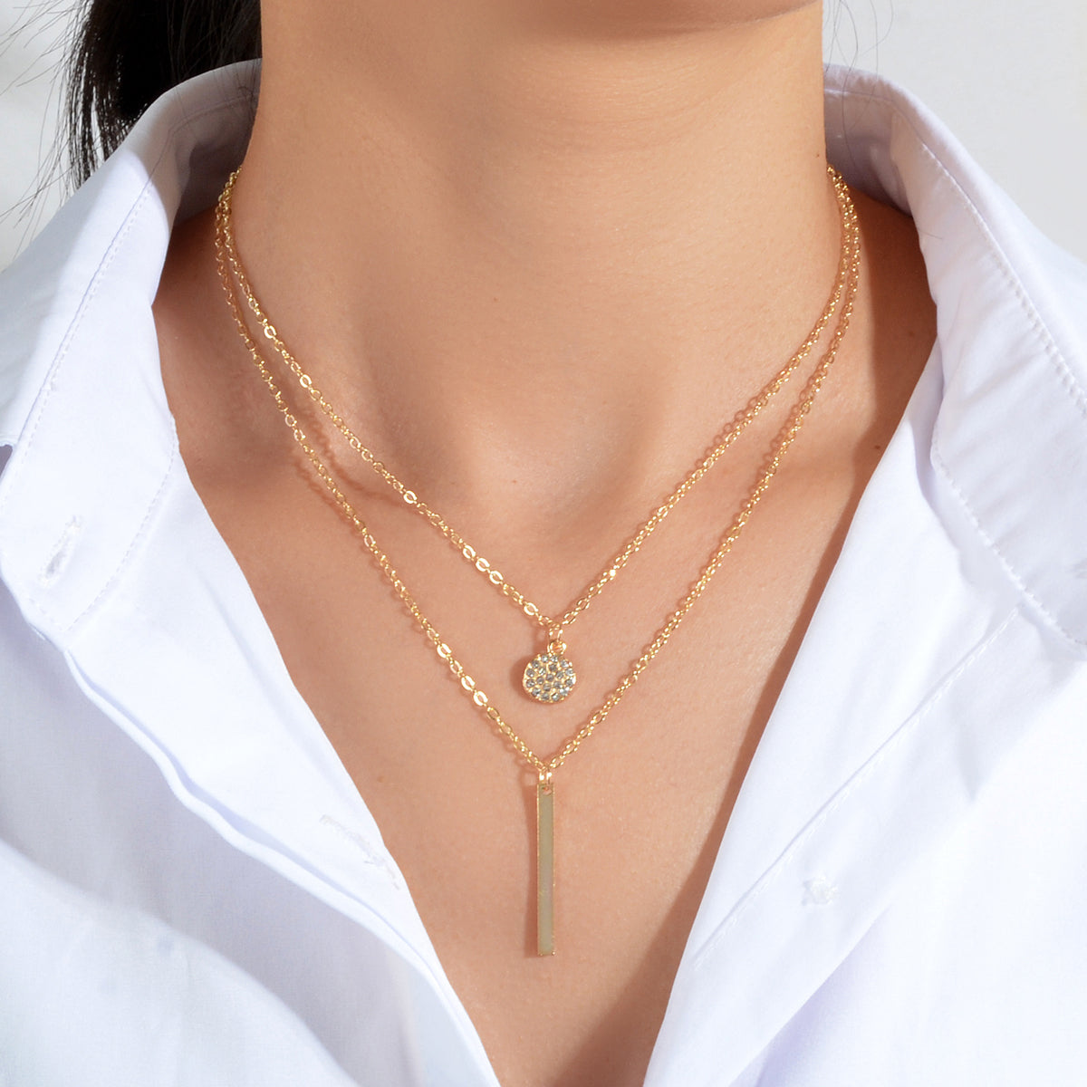 Double layer chain necklace with round charm and bar drop pendant for party and everyday wear