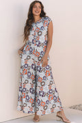 Floral sleeveless wide leg jumpsuit in blue with half button front and side pockets